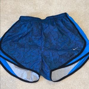 Blue patterned Nike shorts.